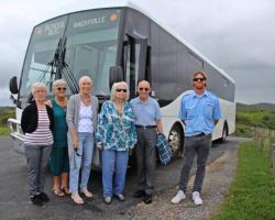 Group of participants on a TinCAN bus trip, supported by Boral