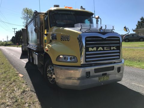 A Boral tipper delivers the roadbase donation to the NSW Rural Fire Service Playground and Memorial in telopea Park, Buxton