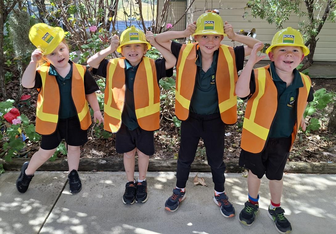 Students at Booyal Central State School wearing Boral hard hats and hi-vis vests