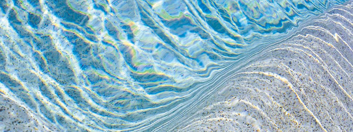 Pool with rippled water over Skypebble finish