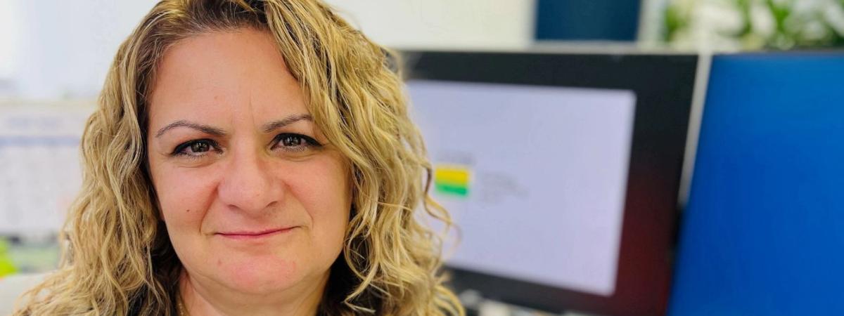 Photo of Michelle Schultze at desk