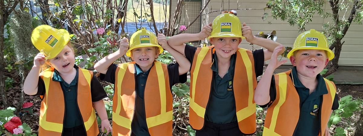 Students at Booyal Central State School wearing Boral hard hats and hi-vis vests