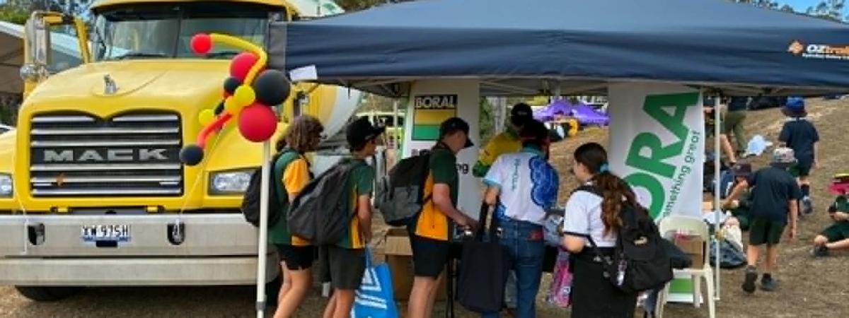 Students exploring Boral stand and agi truck at Dorrie Day 2026 in Bundaberg