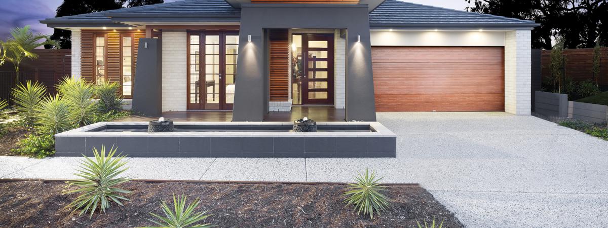 House with exposed concrete driveway