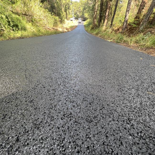 Road paved with asphalt mixed with crumbed rubber