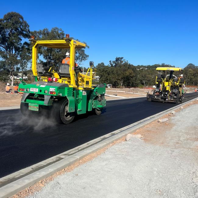 Asphalt paver laying road in Brisbane