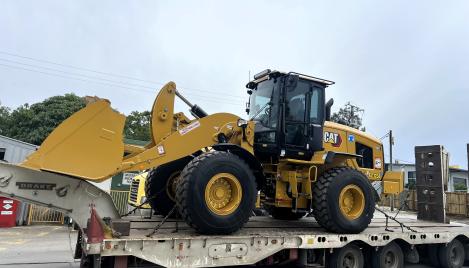 CAT excavator 938 on a truck being delivered to the Noosa plant