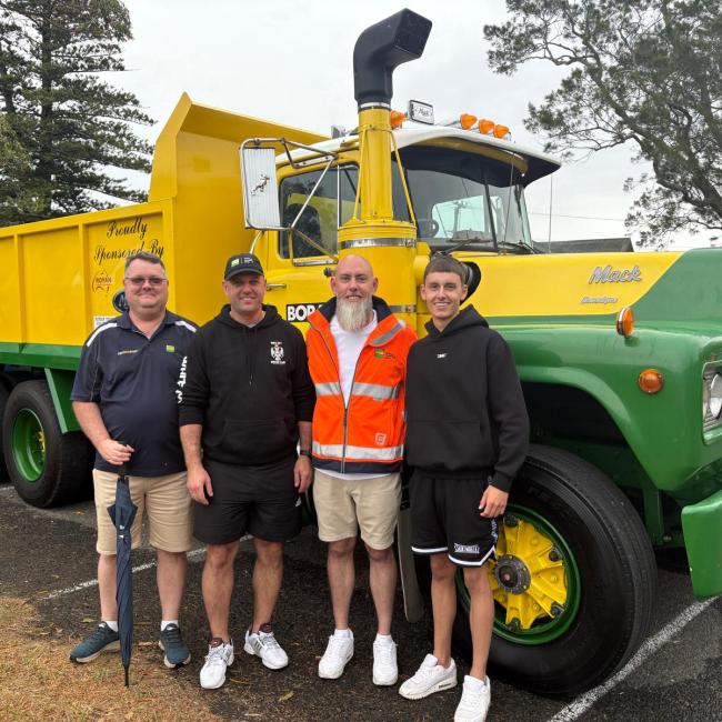 family standing in front of vintage Boral truck at Jamberoo Car Show 2025