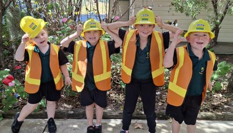 Students at Booyal Central State School wearing Boral hard hats and hi-vis vests