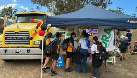 Students exploring Boral stand and agi truck at Dorrie Day 2026 in Bundaberg