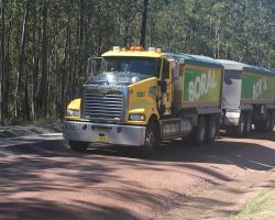A truck delivering road base to works on Italia Road, Balickera
