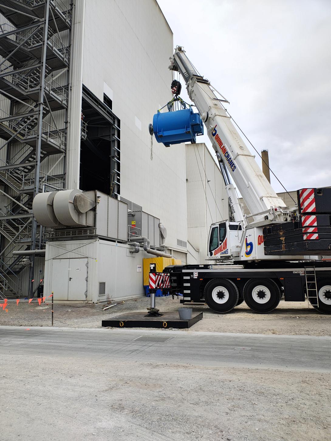 Motor mill hanging from crane