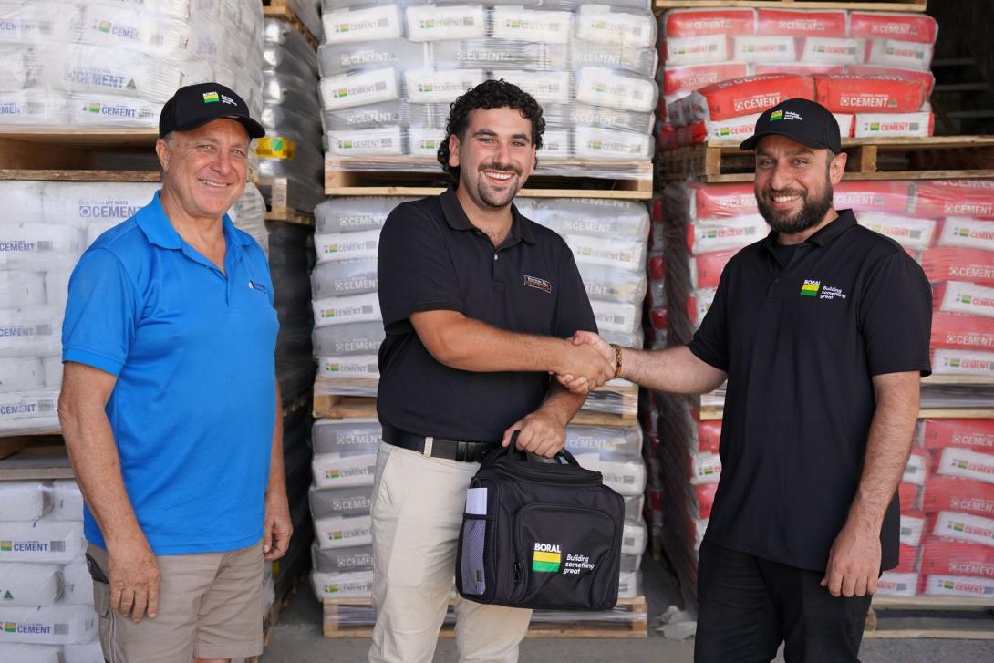 Winner N. Shehadie accepting a TEMPEST Spa prize from Boral Account Manager Ersin Teke and Seymours Building Supplies owner Justin Bucciarelli.