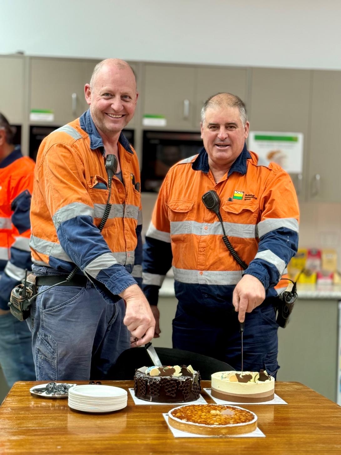 Geoff Smith and Darren Tickner cutting cakes at Berrima