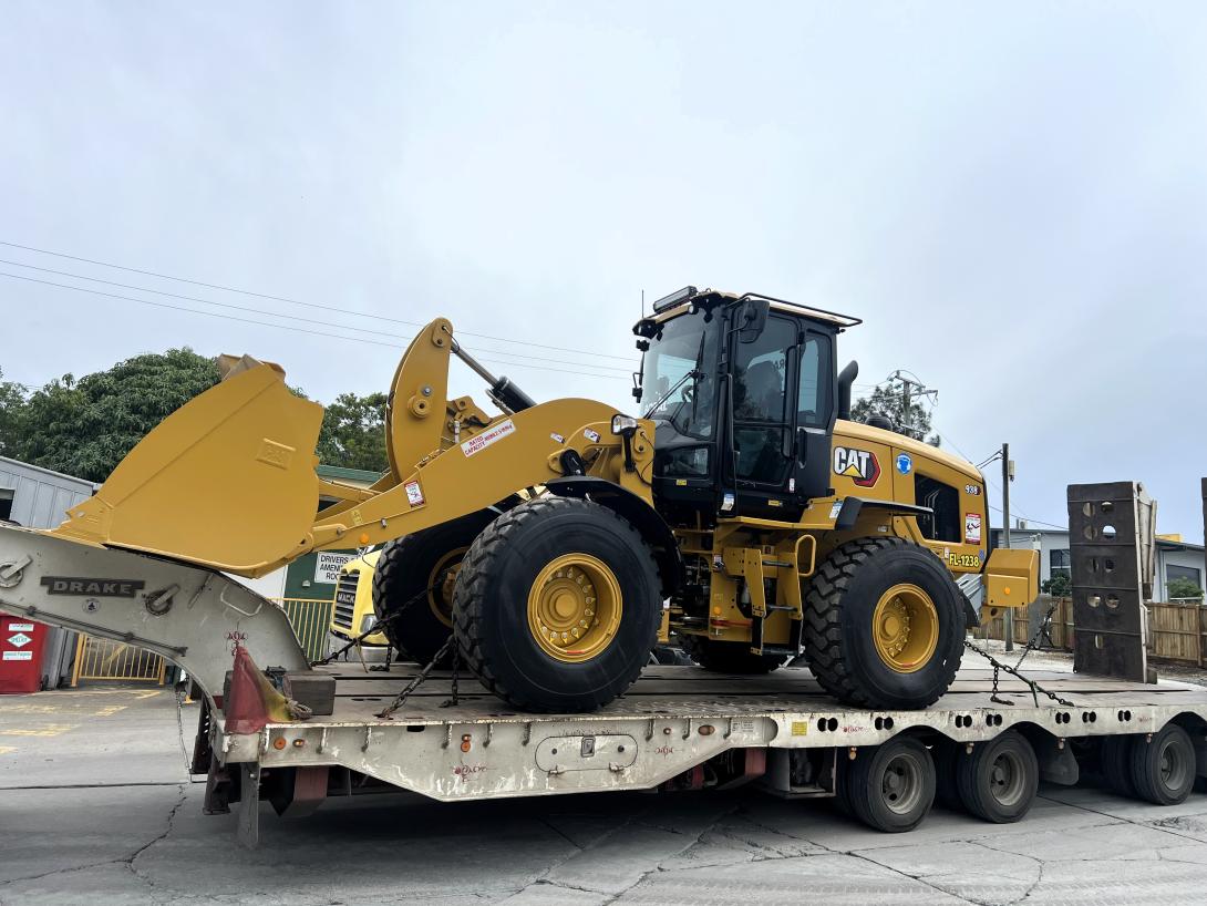 CAT excavator 938 on a truck being delivered to the Noosa plant