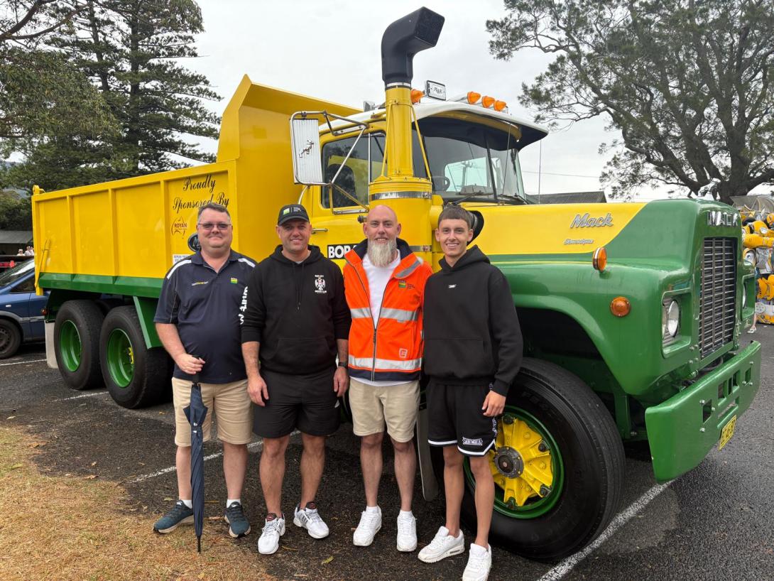 family standing in front of vintage Boral truck at Jamberoo Car Show 2025