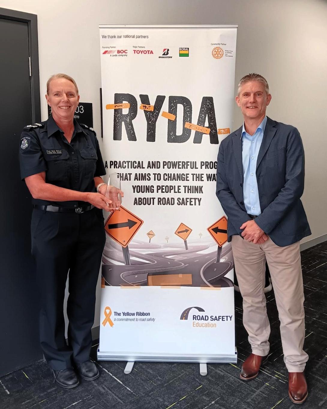 Leading Senior Constable Lee‑Anne Nelson receives the Boral Supporting Excellence Police Award from Duncan Harris, Executive General Manager Concrete and Quarries Victoria.