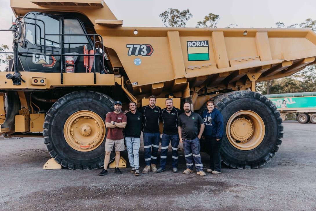 Local community pose with HME at Seham Quarry
