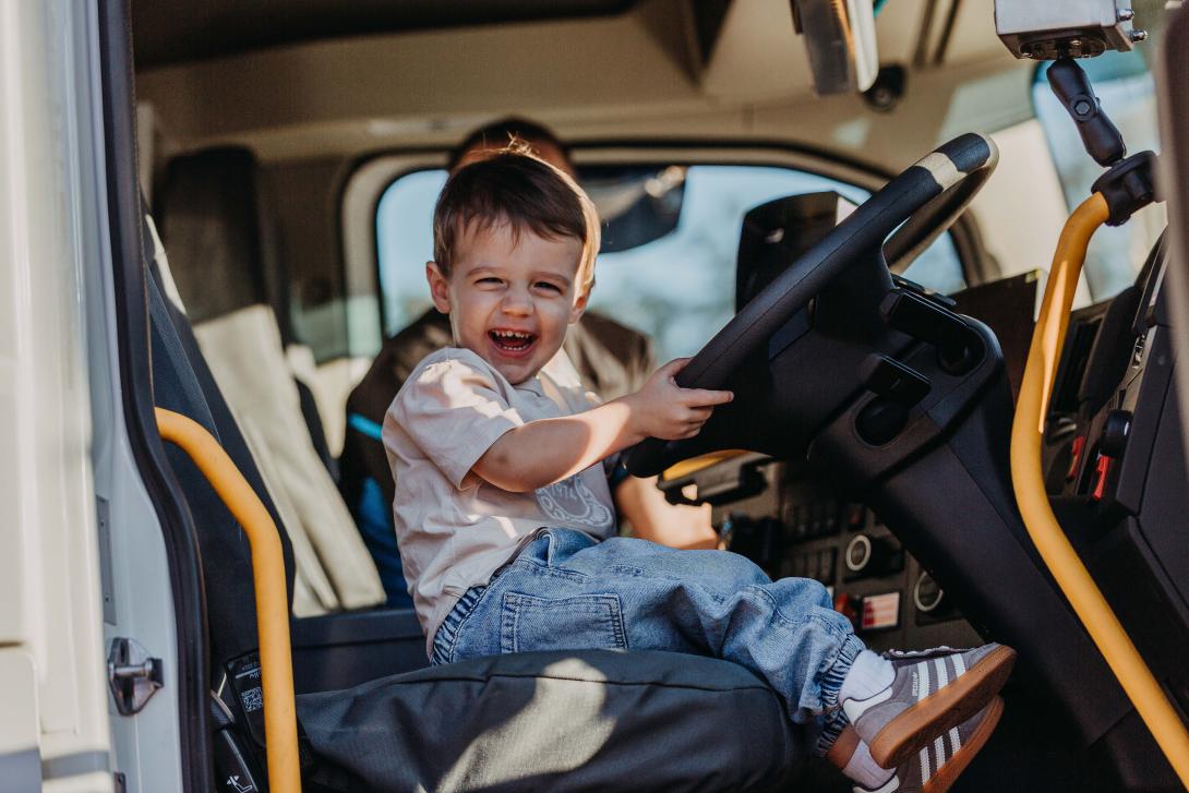 Children sit in drivers seat of HME at Seaham Quarry