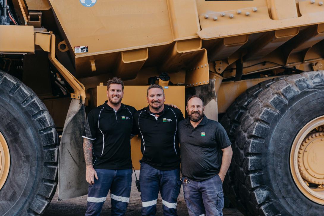 Local community pose with HME at Seham Quarry