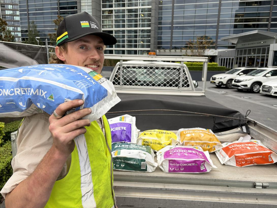 Tradie standing with Boral new plastic packaging