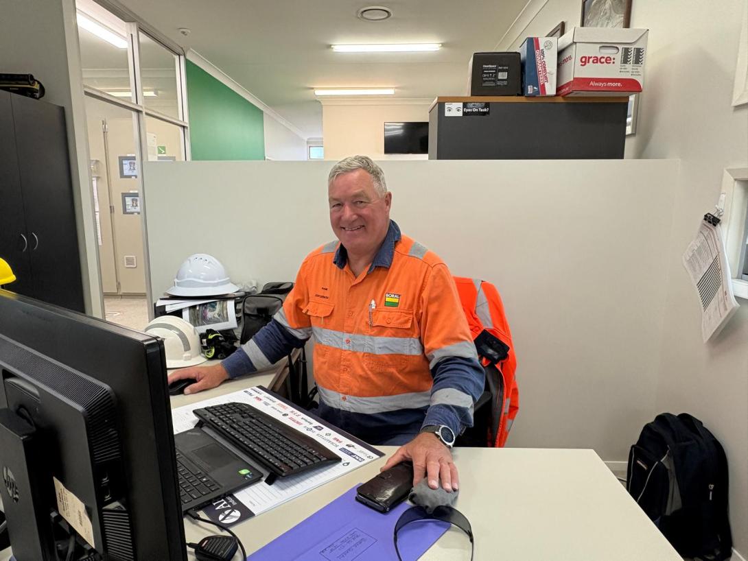 Boral employee Frank Lourey in PPE sitting in office