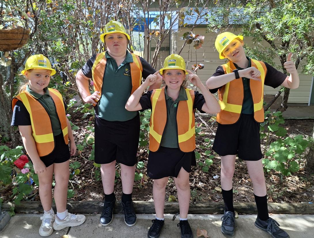Students at Booyal Central State School wearing Boral hard hats and hi-vis vests