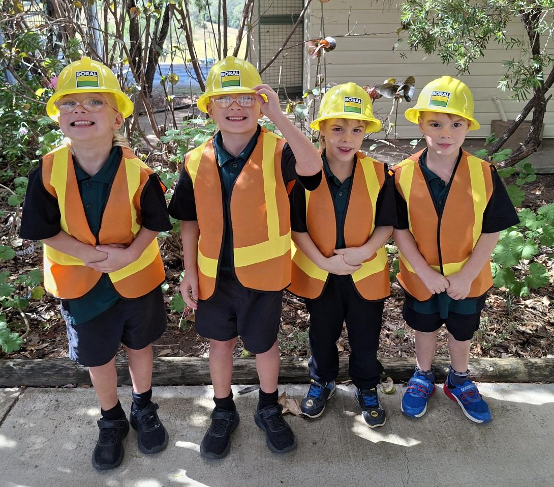 Students at Booyal Central State School wearing Boral hard hats and hi-vis vests
