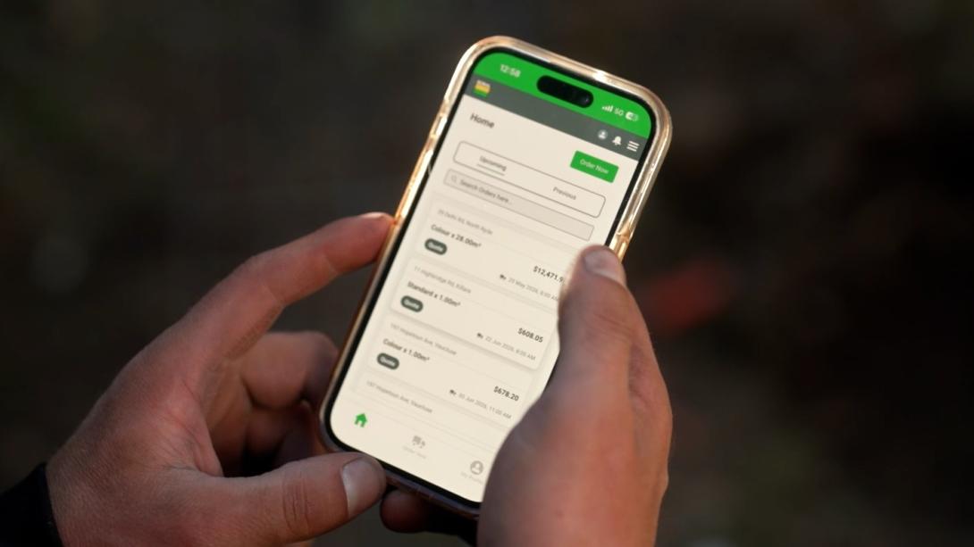 close up of mobile phone showing boral concrete app ordering process