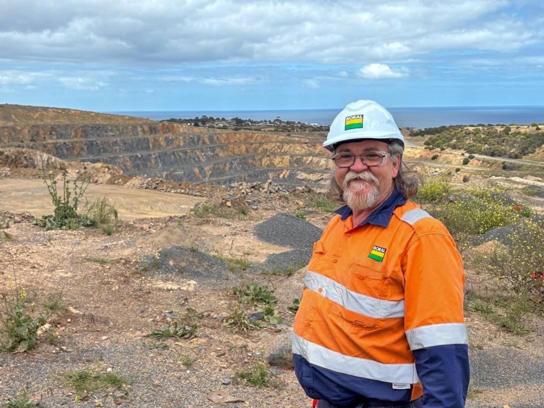 Boral employee standing in orange PPE at Linwood quarry in South Australia