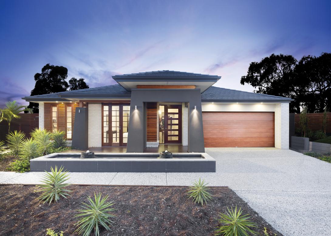 House with exposed concrete driveway